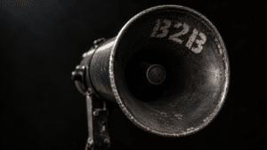 A vintage bullhorn or megaphone with the letters 'B2B' stencilled on it.